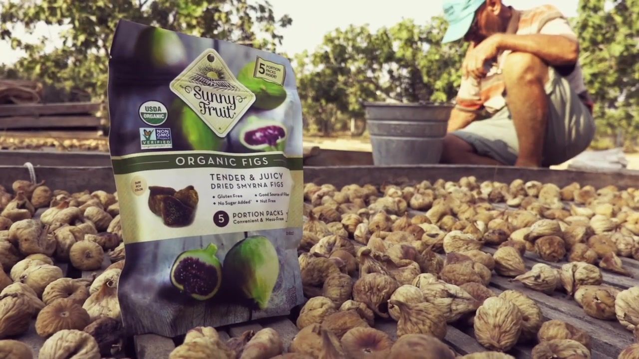 A bag of Sunny Fruit organic dried figs on the racks where the figs are sun-dried